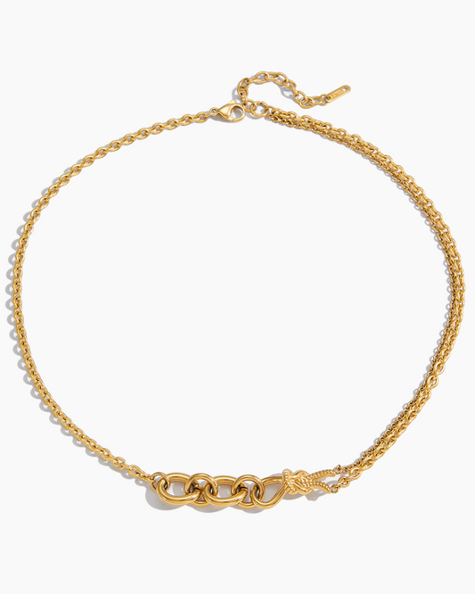 Gold chain necklace on a white background