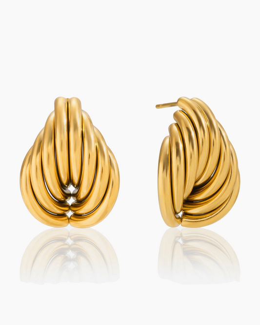 Pair of gold hoop earrings on a white background