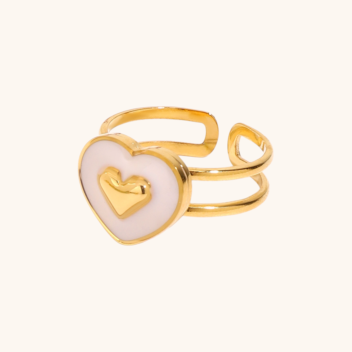 White enamel heart ring with gold double band, model hand shot