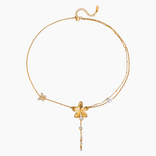 Gold necklace with floral design on a white background