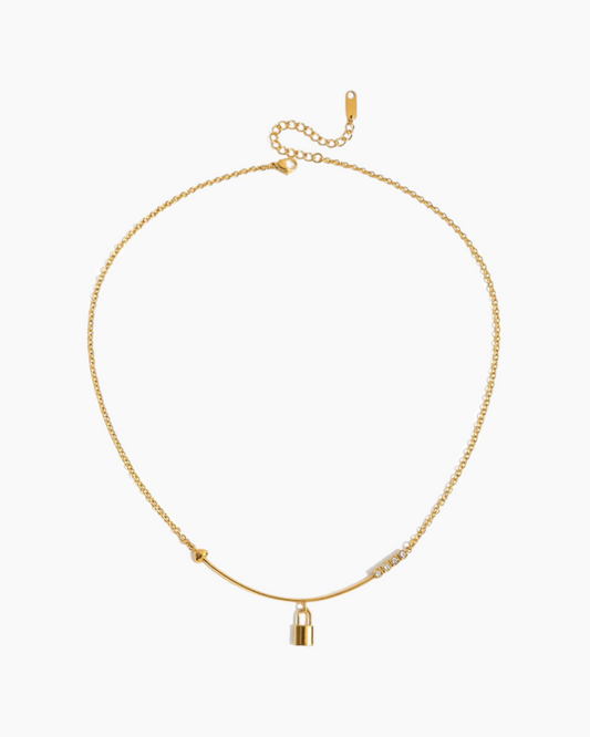 Gold necklace with a lock pendant on a white background