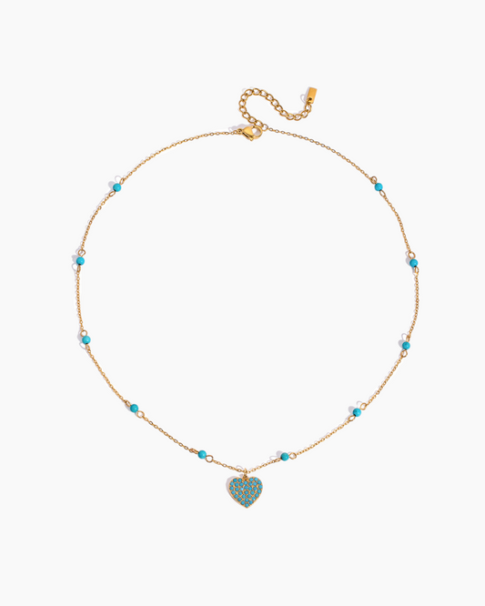 Necklace with a heart-shaped turquoise pendant on a white background