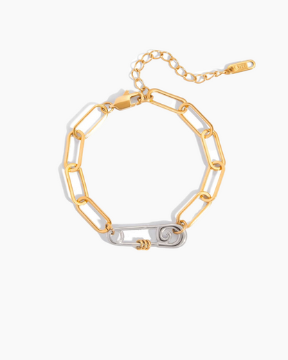 Gold and silver chain bracelet on a white background