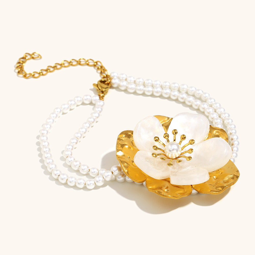 Handcrafted gold and white floral bracelet with dual pearl strands