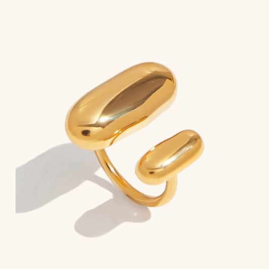 Isolated image of gold high-polish open ring with curved shape, lightweight and adjustable
