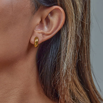 Lightweight huggie earrings styled with summer outfit