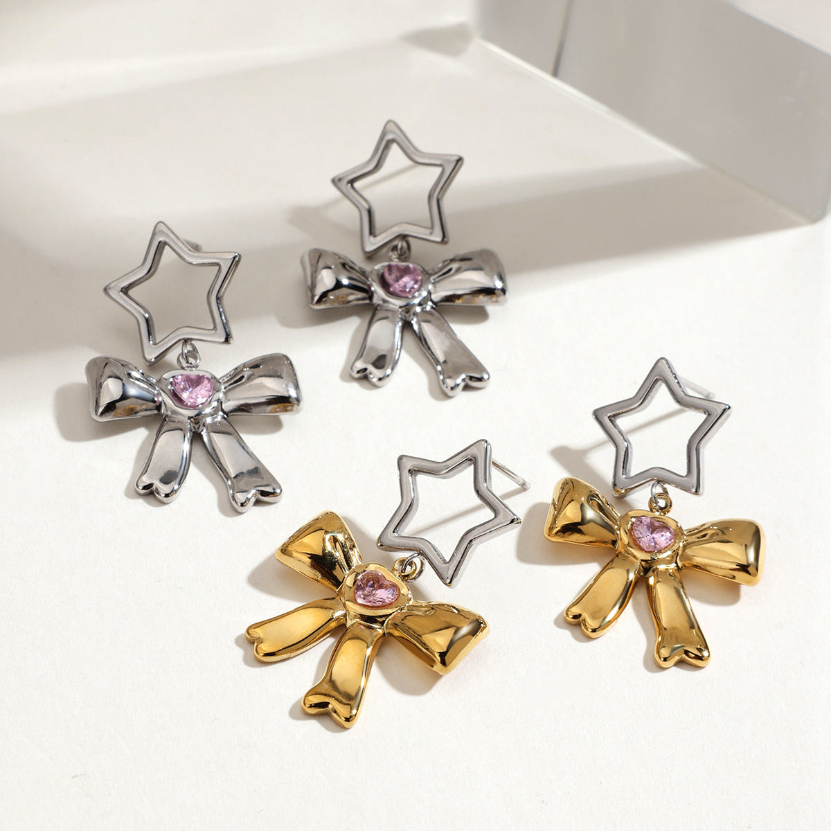 Cute Y2K bow earrings with heart-shaped pink crystals and star studs