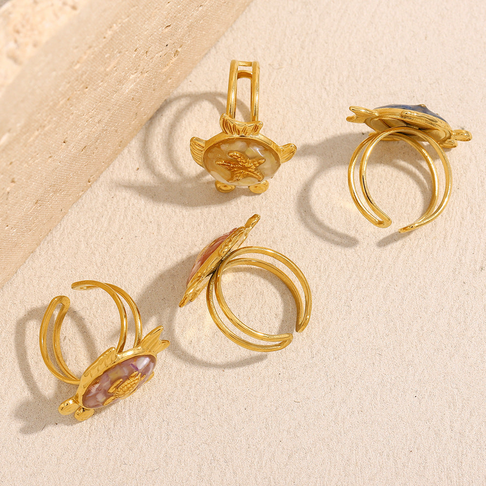 Assorted ocean animal rings featuring turtles and starfish in colorful shell inlays