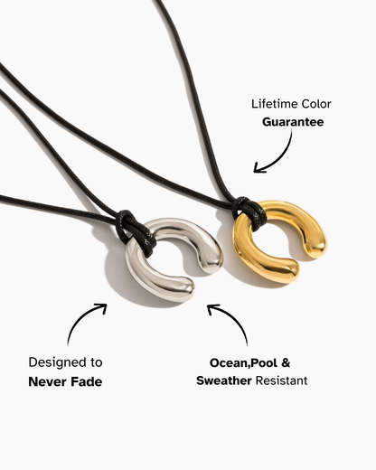Two necklaces, one silver and one gold, on a white background with text about color guarantee and durability.