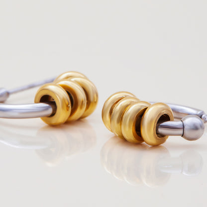 Two-tone hoops styled on ear for casual everyday wear