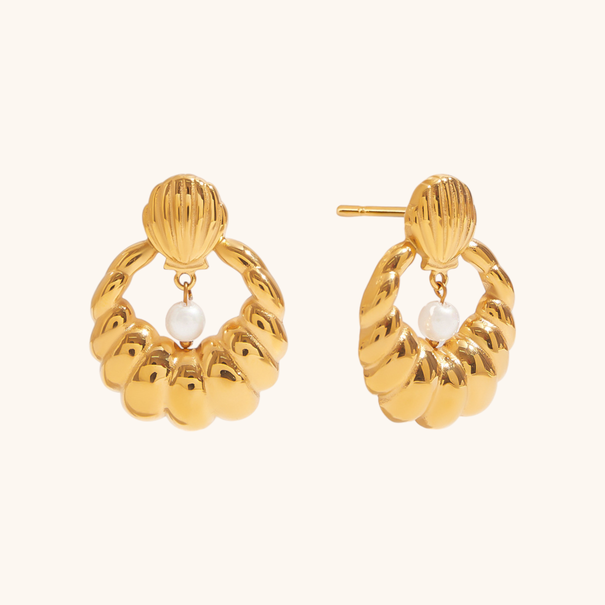 Shell-inspired waterproof earrings on breakfast table setting