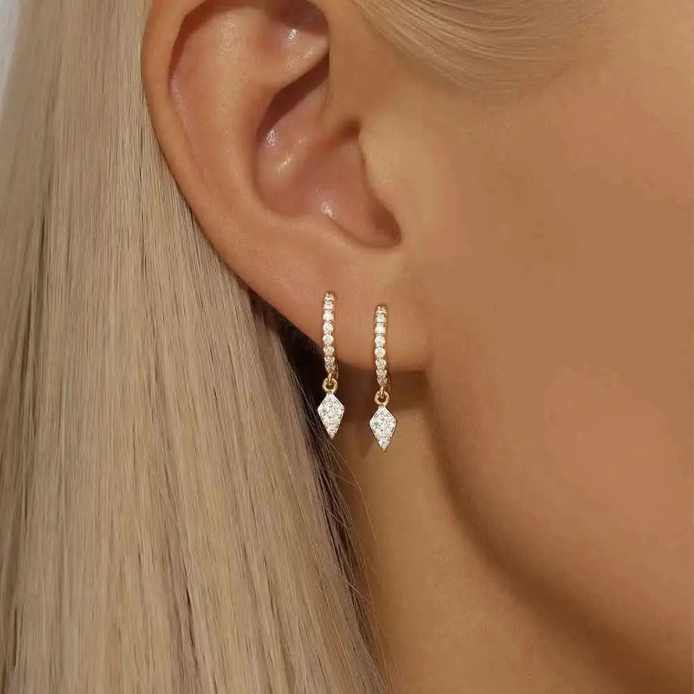 Make a stellar statement with these moon and star chain hoop earrings in gold.