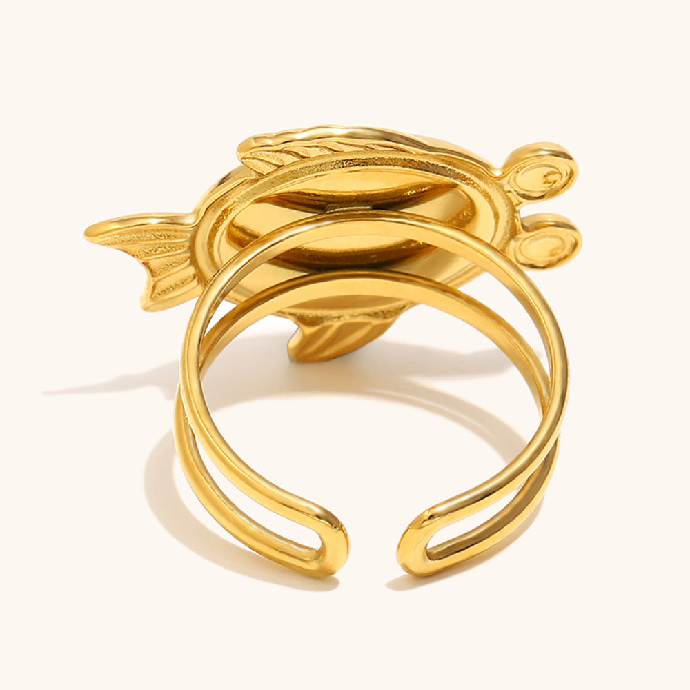 Close-up of pink turtle ring with golden double band