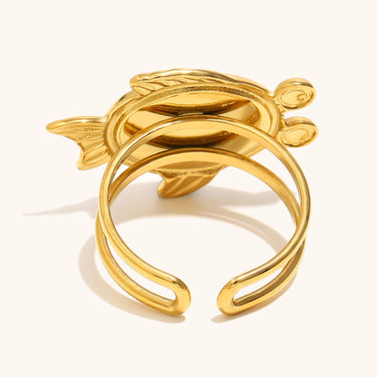 Close-up of pink turtle ring with golden double band