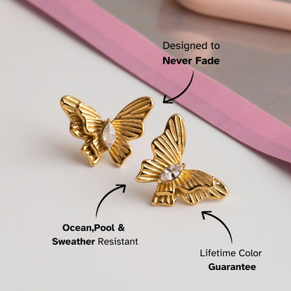 Stylish butterfly-shaped earrings with clear stone detailing, paired with matching jewelry