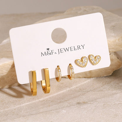 Small round gold hoops with clear crystals, elegant everyday earring choice