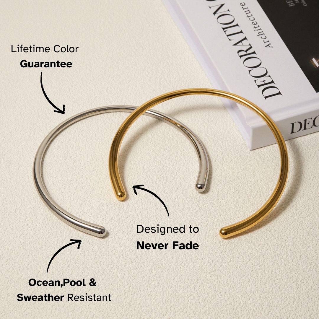 Gold and silver open cuff bracelets on a book — minimalist, waterproof, and color-guaranteed design loved by European women