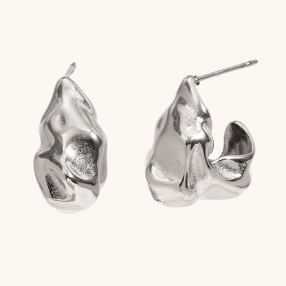 Side profile of gold molten-effect hoop earrings