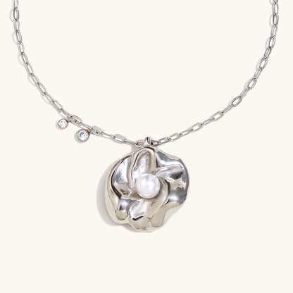 Silver floral pendant necklace with central pearl on minimalist chain
