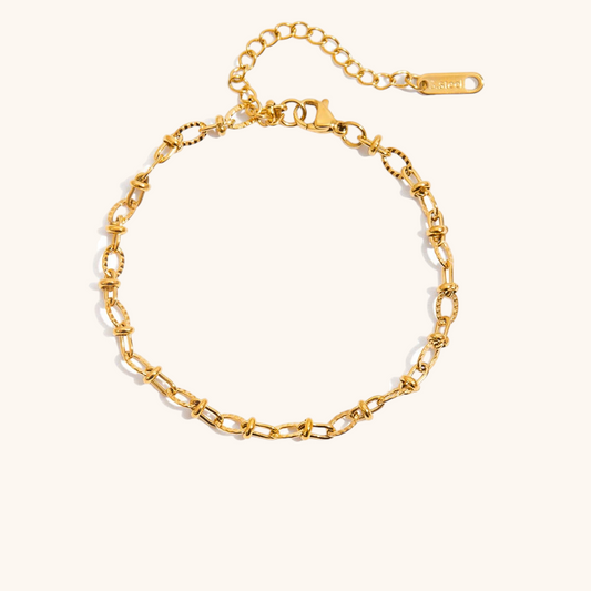 Layered gold bracelet with hammered and twisted chains, durable for ocean and sweat