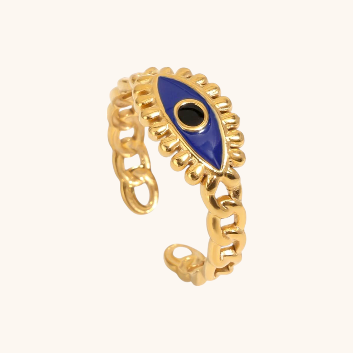 Close-up of gold evil eye ring with blue enamel center