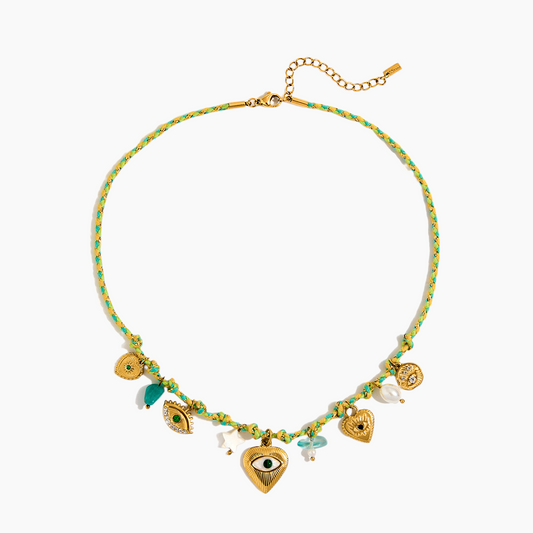 Necklace with heart and eye charms on a white background