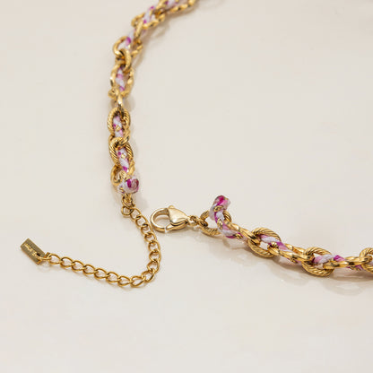 Beach-ready necklace with colorful thread and dangling charms