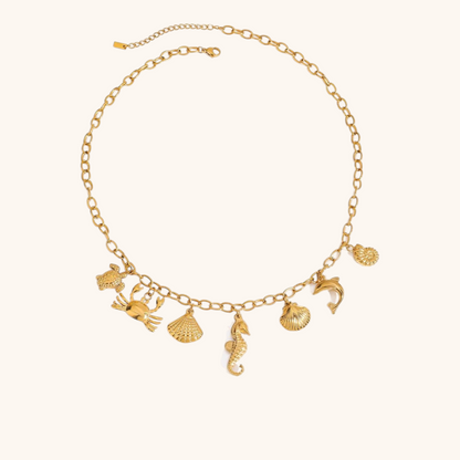 Gold chain necklace with seahorse and sea creature charms, perfect for beach outfits