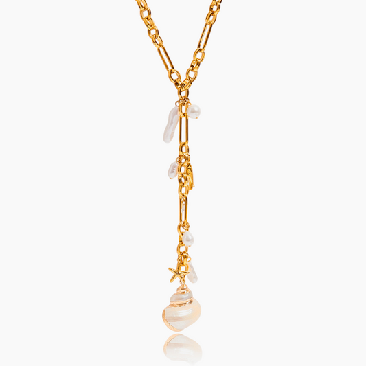 Gold necklace with pearls on a white background