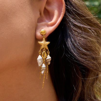 Beach-inspired dangling earrings styled for vacation looks