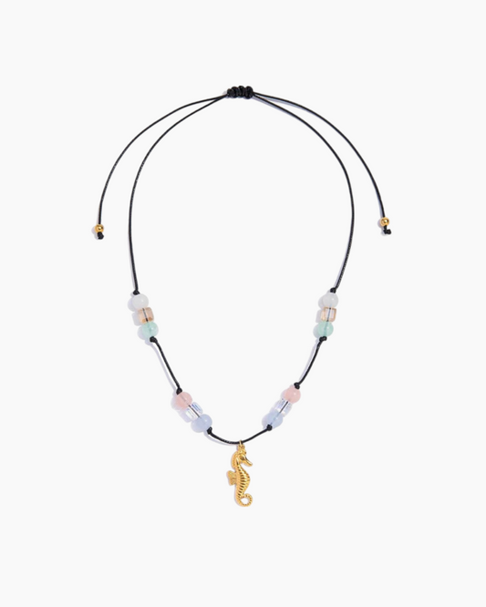 Necklace with seahorse charm and multicolored beads on a white background