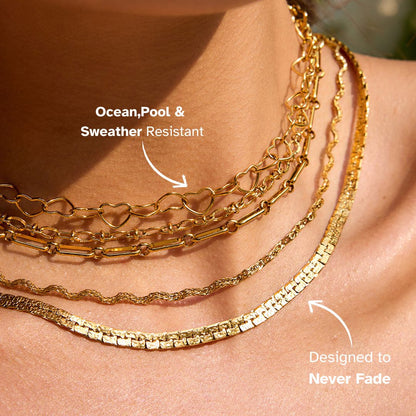 Multiple-layer gold chain necklaces styled with beach-ready summer outfit.