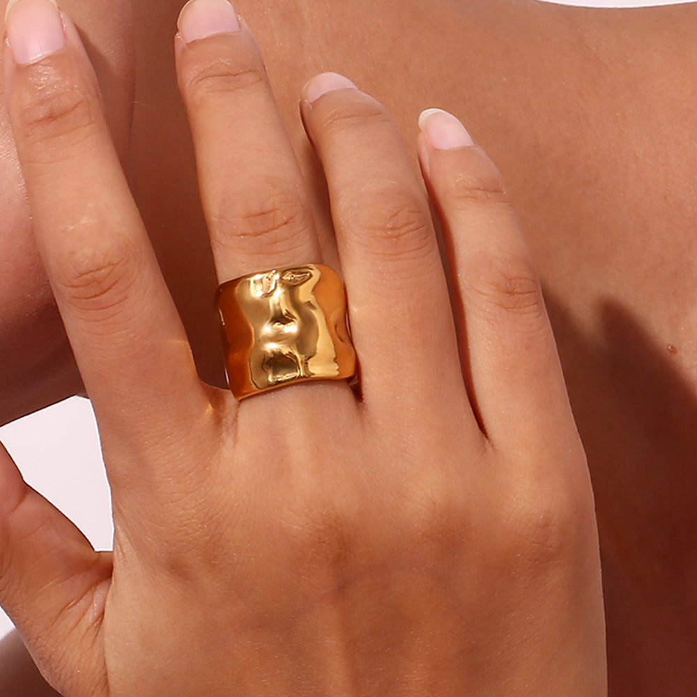 Side view of open cuff ring highlighting adjustable gap and sculptural curves