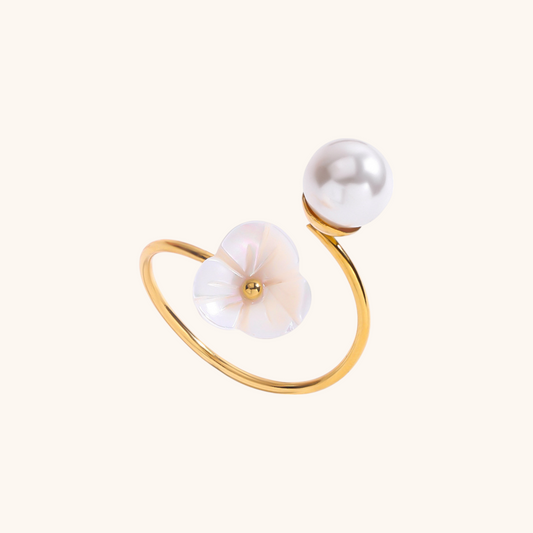Gold open ring with white mother-of-pearl flower and round pearl detail