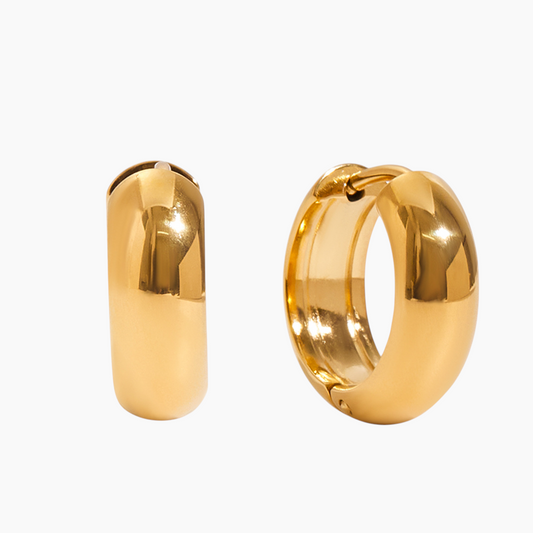 Gold hoop earrings on a white background