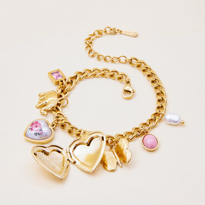 Layered gold bracelet with heart locket and cute charms for women