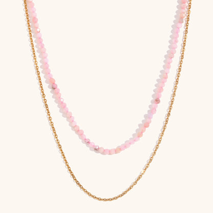 Feminine pink double-strand necklace featuring round-cut crystals and gold accents