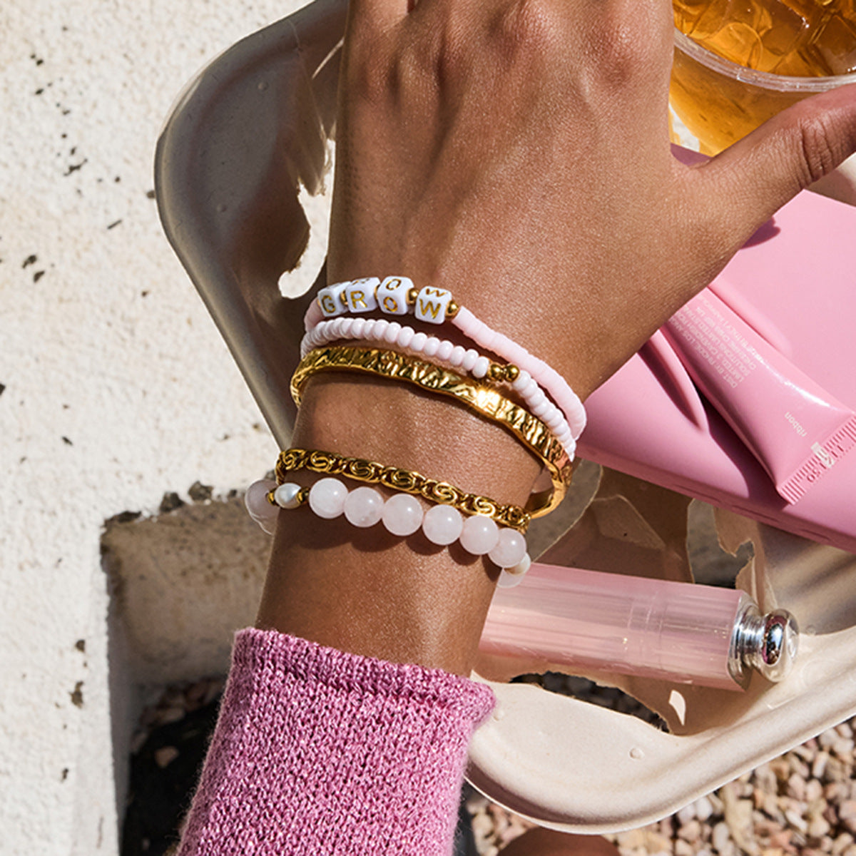 Beach-friendly colorful word bead bracelet stack on wrist
