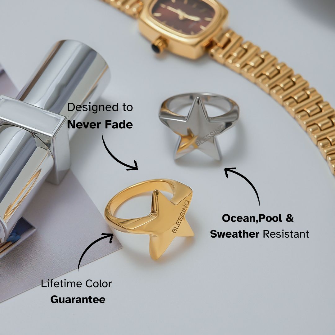 Studio light image showing gold and silver star rings with engraved "BLESSING"