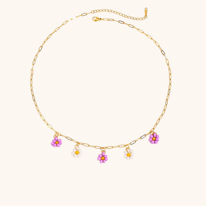 Minimalist purple and white beaded floral charm necklace on gold chain