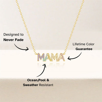 Colorful crystal MAMA necklace on gold chain, minimal background