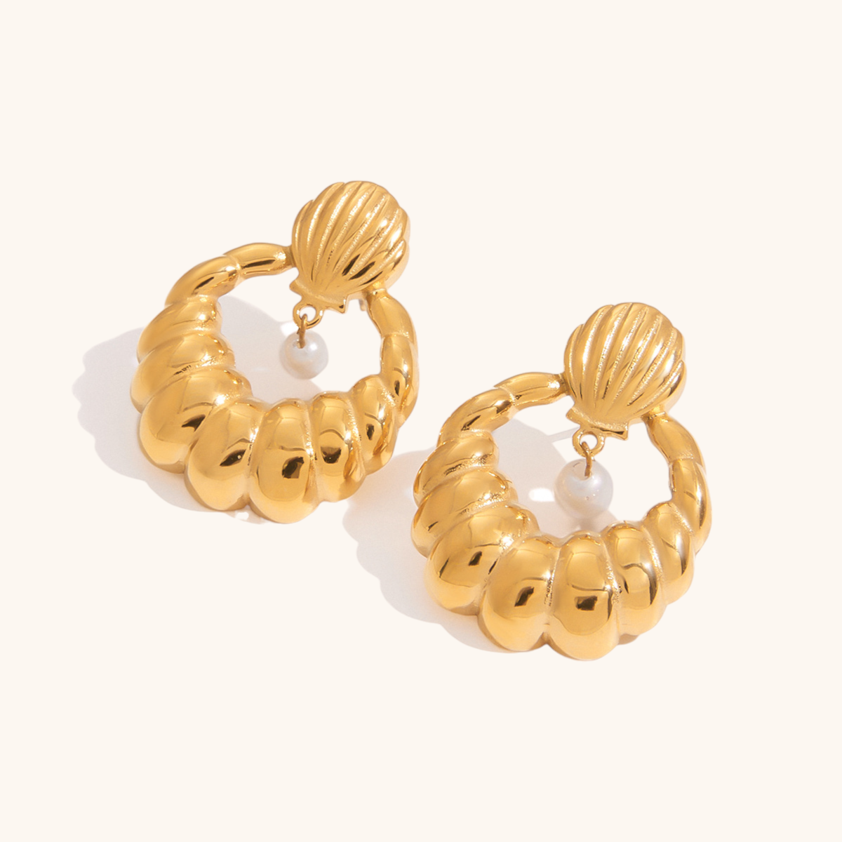 Statement gold hoop earrings with pearl charm and shell design