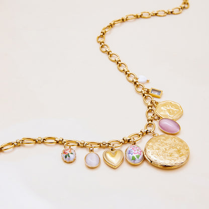 Elegant gold chain necklace with vintage-inspired floral heart pendants