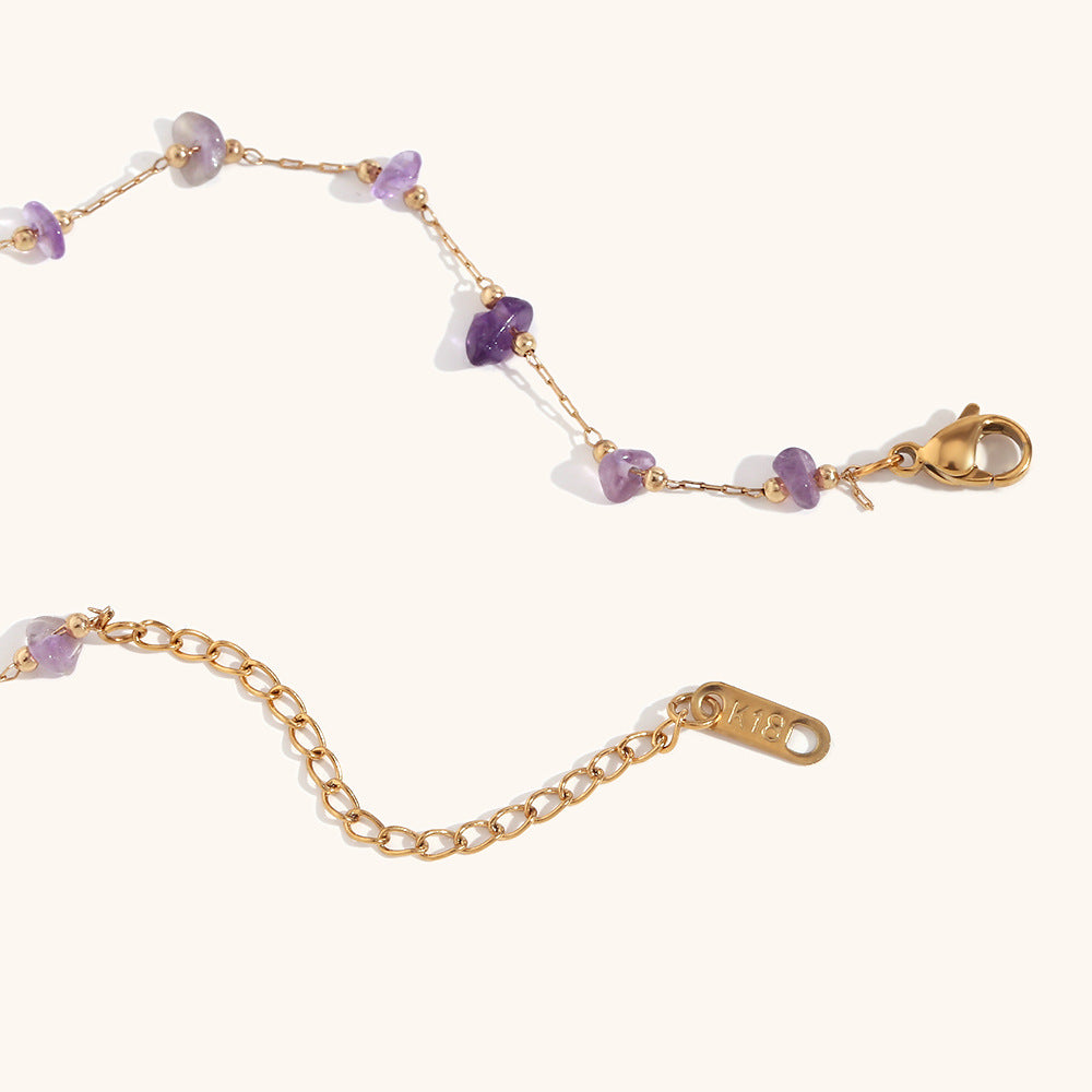 Soft pink rose quartz chip necklace displayed on white background