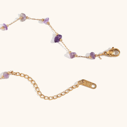 Soft pink rose quartz chip necklace displayed on white background