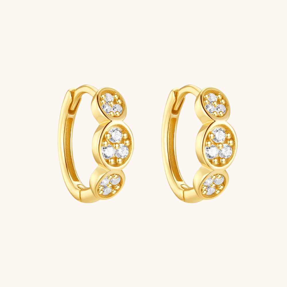 Boucles d'oreilles Huggie en zircone groupée