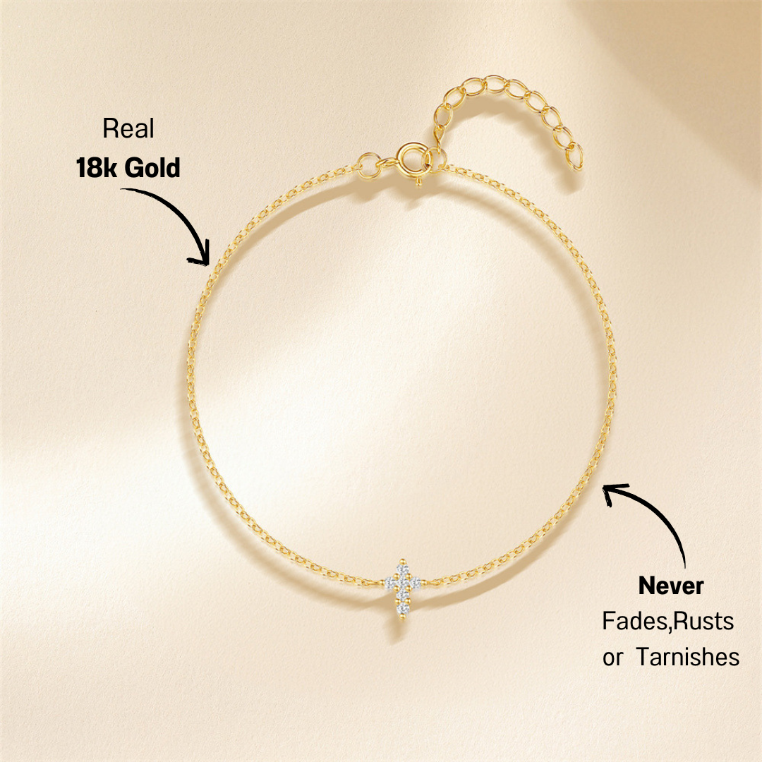 S925 sterling silver cross bracelet with zirconia stones on a textured flat surface.