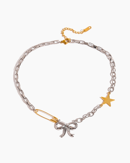 Bracelet with bow and star charms on a white background