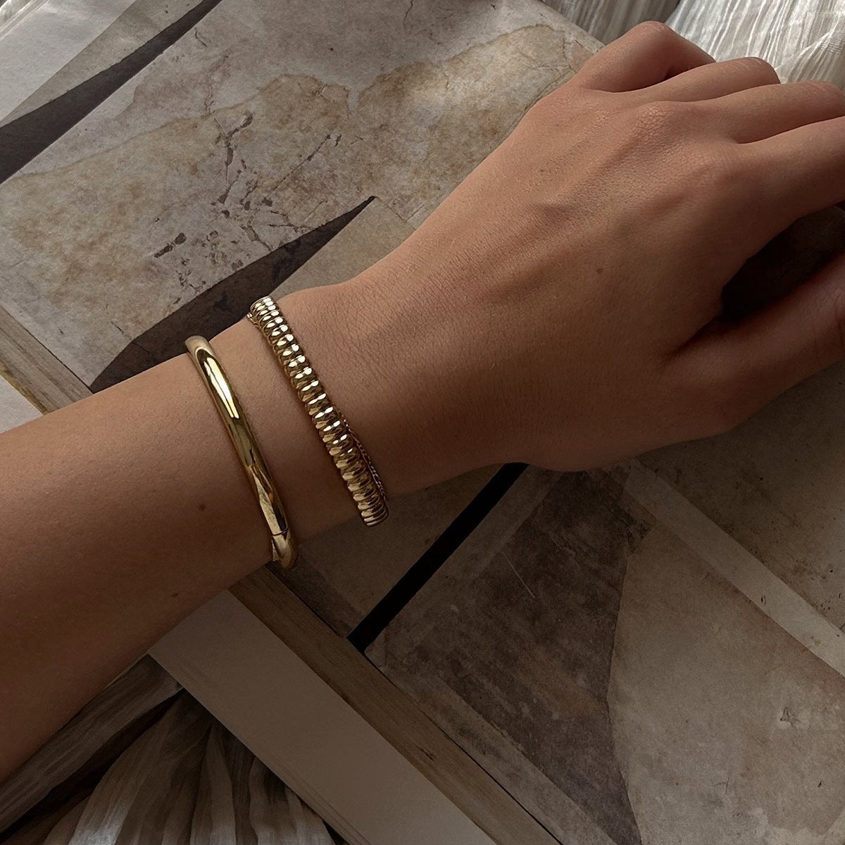 Sculpted gold bracelet with rounded bead details, minimal and stylish look