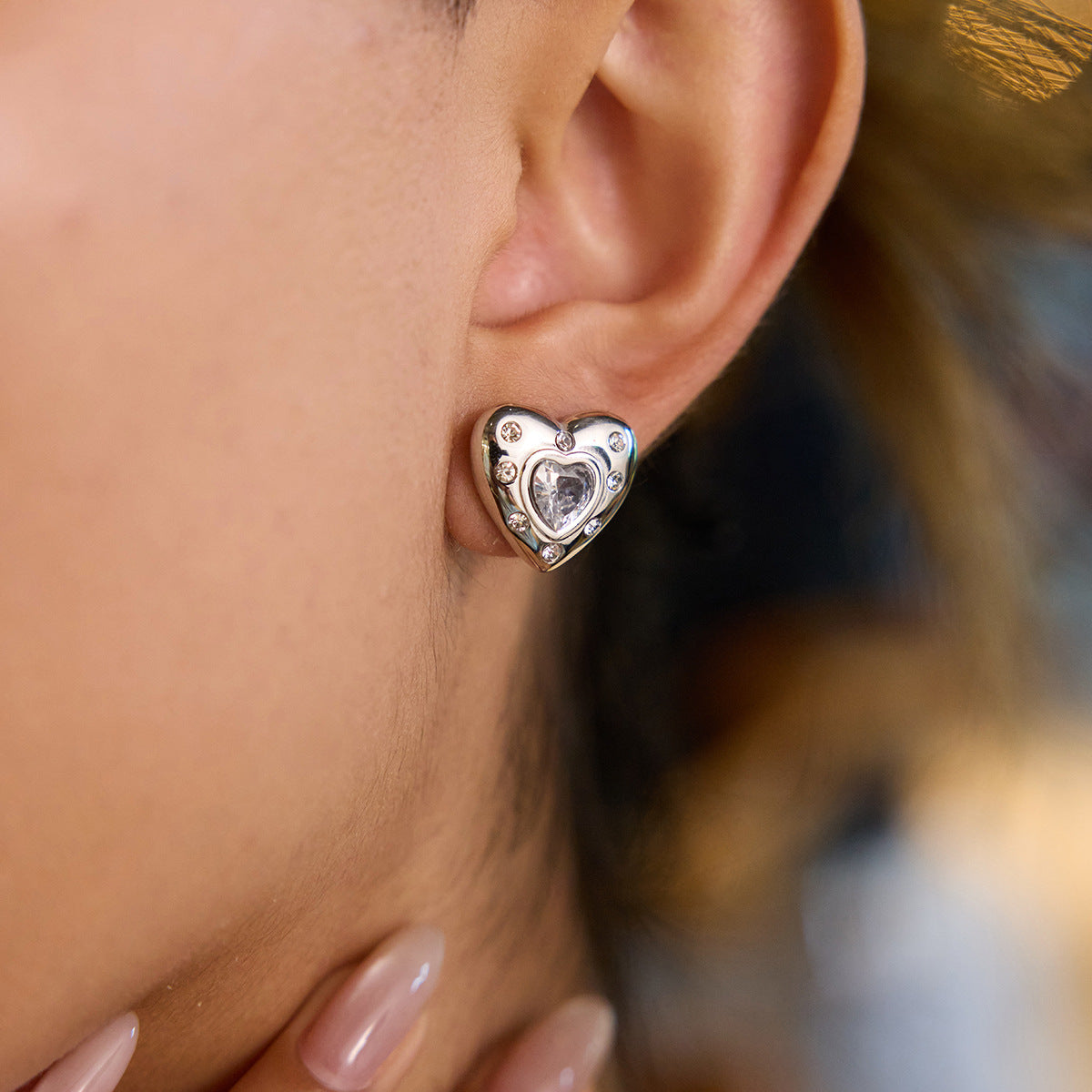 Silver heart studs featuring CZ gem center, perfect for daily wear or stacking with hoops